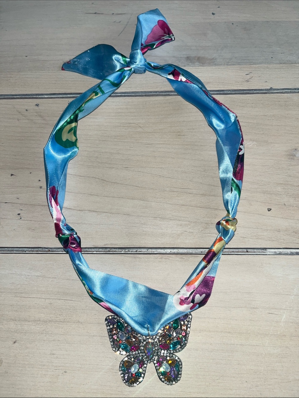 Blue Floral Ribbon Necklace with Jeweled Butterfly Pendant